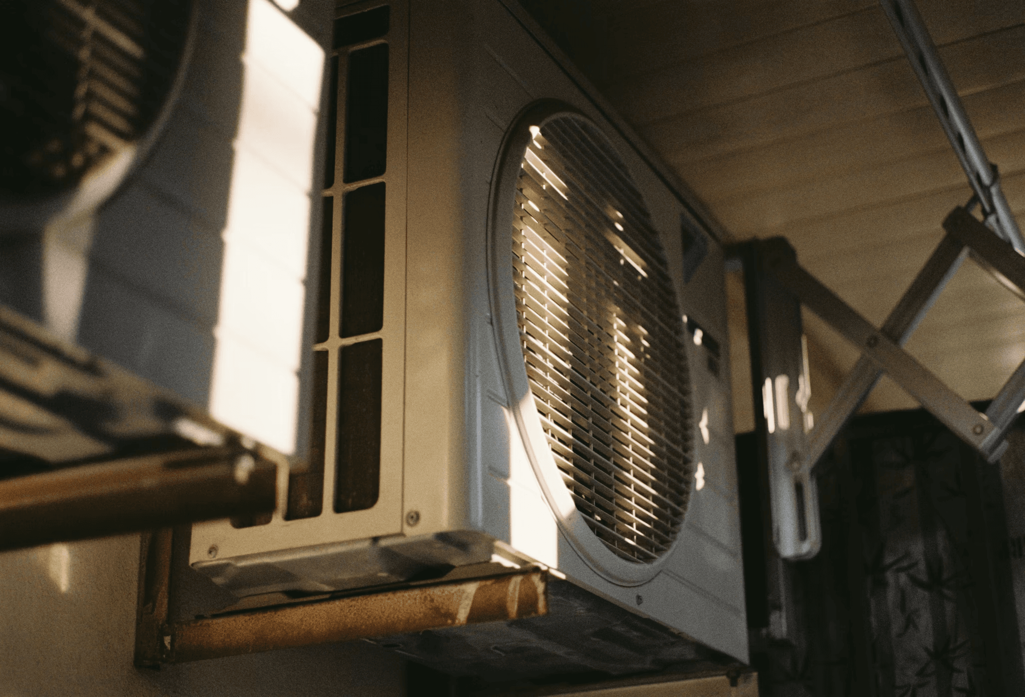 Close-up of the coil and fan on a heat pump outdoor unit